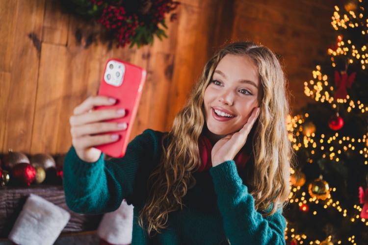 a cheerful girl taking a photo