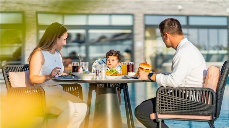 A family enjoying the energetic atmosphere of the Aegean at Elite World Kuşadası