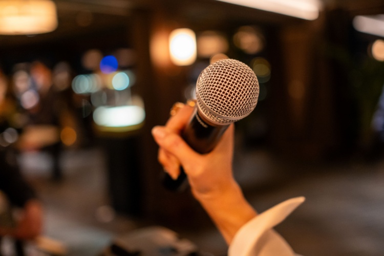 A woman holding a microphone