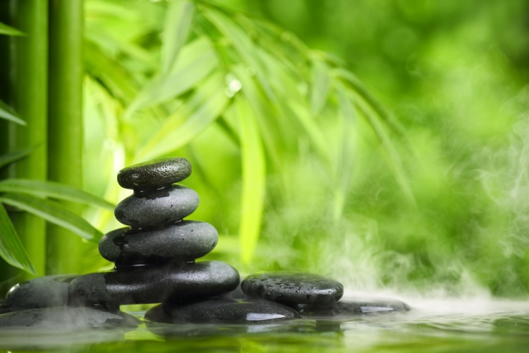 Spa concept with hot zen stones and bamboo
